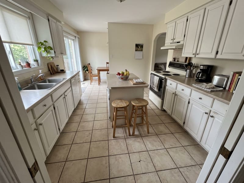 Before: kitchen with dated almond tile