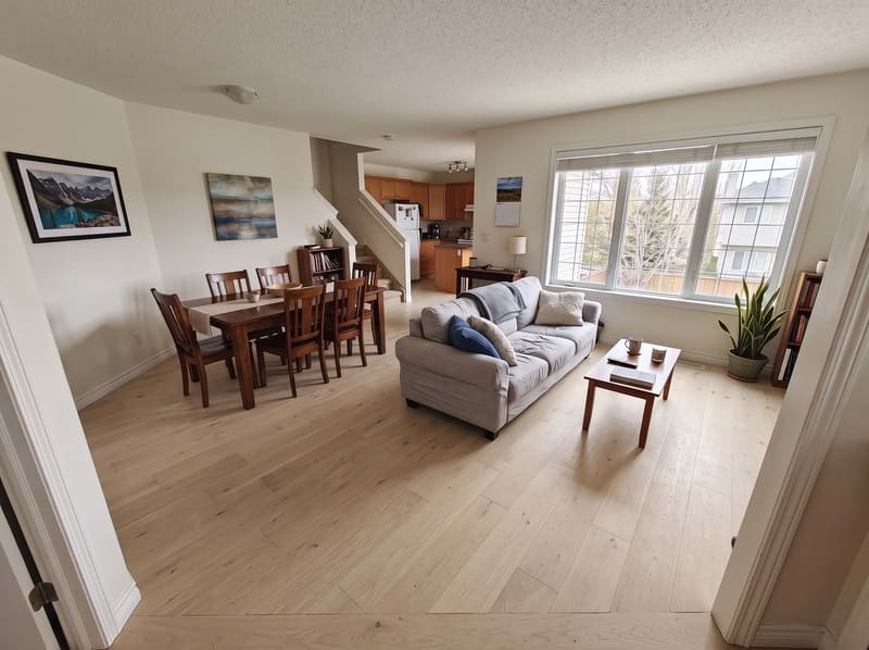 After: the same open living and dining room with White Oak, natural hardwood, rendered by the Flooring Local visualizer